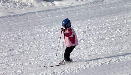 Little skier on ski slope