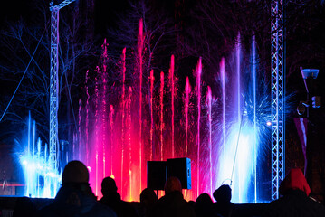 Fototapeta na wymiar Colorful fountain at night, Liepaja, Latvia