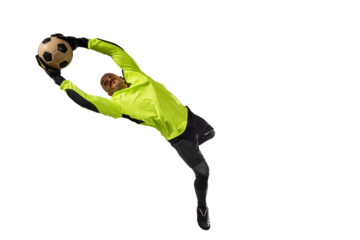 Goalkeeper catches the soccer ball during a football match