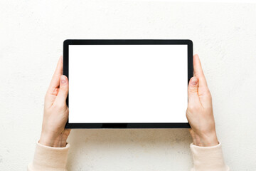 female teen hands using tablet pc with white screen, Mockup image of woman hand holding white tablet pc with blank white screen at home
