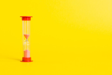 hourglass on the table, sand clock as time passing concept for business deadline, copy space