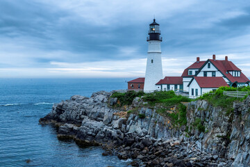 Fototapeta na wymiar Portland Head Lighthouse at morning with stormy dramatic sky in Cape Elizabeth, New England, Maine, USA.