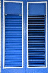 Beautiful blue wooden shutters, detail of one of the Cuban restaurants.

