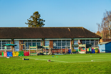 Fototapeta na wymiar British Junior school playground & infant school playing fields on a sunny day