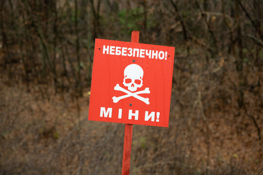 Danger sign in front of minefield - Ukraine, Donbass: Danger mines