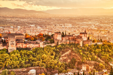 Fototapeta na wymiar Alhambra Fortress Aerial View at Sunset with Sun Light, Granada, Andalusia