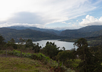 Colombian guavio dam lake landscape on sunny sunset blue sky