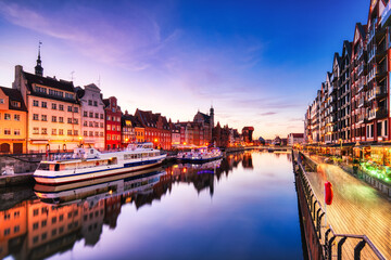 Illuminated Gdansk Old Town with Calm Motlawa River at Sunset, Poland