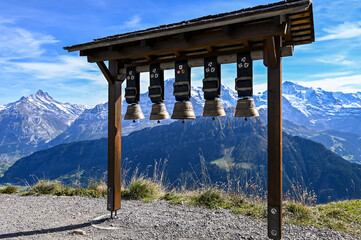 Cow bells at Schynige Platte with a view on the mountain range Eiger Moench Jungfrau