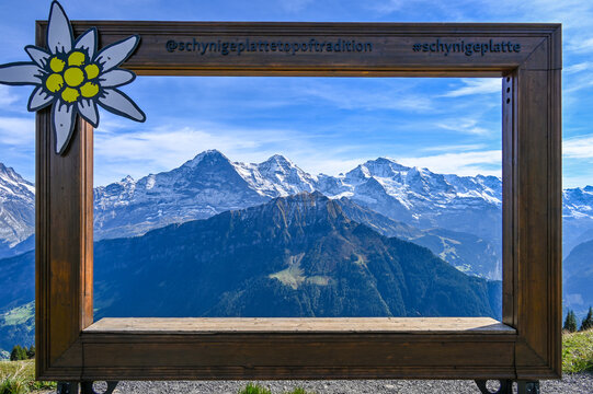 Wooden frame with a view on the mountain range Eiger Moench and Jungfrau in the Swiss alps