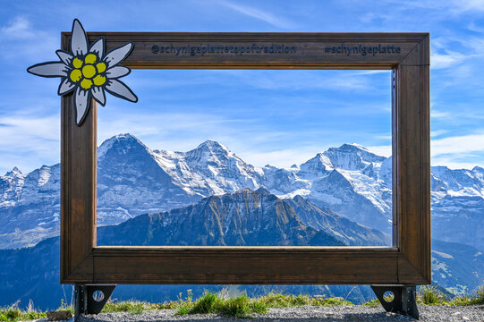 Wooden frame with a view on the mountain range Eiger Moench and Jungfrau in the Swiss alps