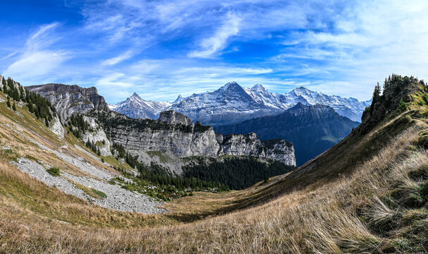 Panoramic view on the mountain range Eiger Moench and Jungfrau in the Swiss alps