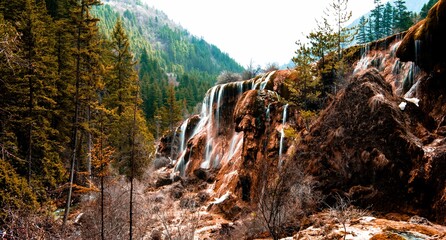 Long exposure shot of the beautiful cascading rocky waterfall
