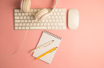 Headphones, keyboard and notepad