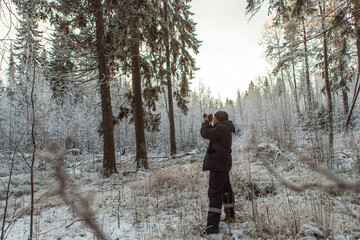 Professional photographer photographs the winter landscape