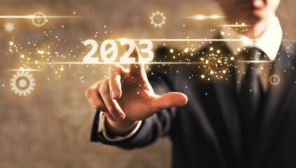 2023 text with businessman on dark vintage background