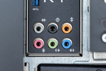 Closeup shot of firewire and small inputs on a digital computer workstation