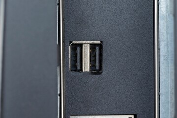 Closeup shot of firewire and small inputs on a digital computer workstation