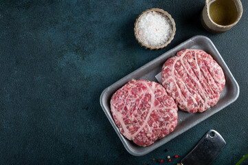 Raw minced meat and ingredients for home made grill burgers. Semifinished food. American cuisine. Raw burger