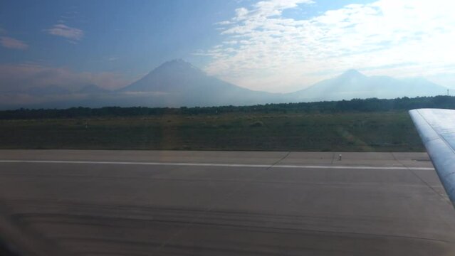 Kamchatka roads and volcanoes as a typical natural background. Video shooting from a plane