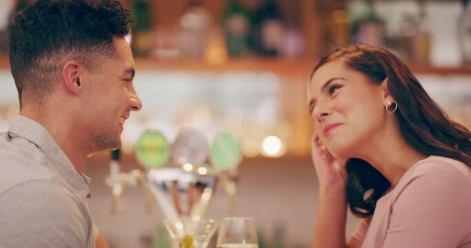 Love, flirt and couple on date in restaurant enjoying company, drinks and laugh together at social event. Relationship, dating and young man and woman talking, speaking and have romantic conversation