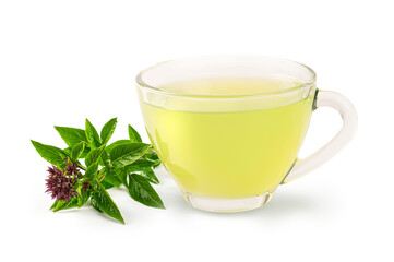 Glass cup of basil tea with basil leaves isolated on white background.