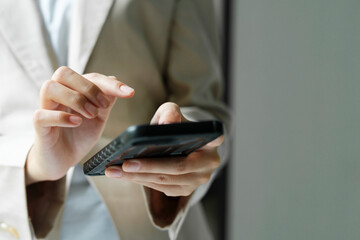 Close up of Businesswoman working at office using telephone.