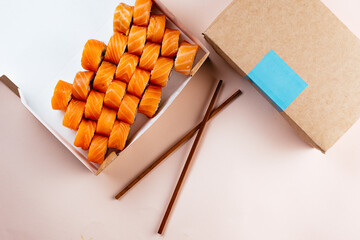 sushi rolls in a paper takeaway box for delivery