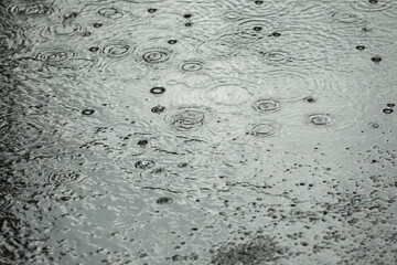 View of heavy pouring rain on city street
