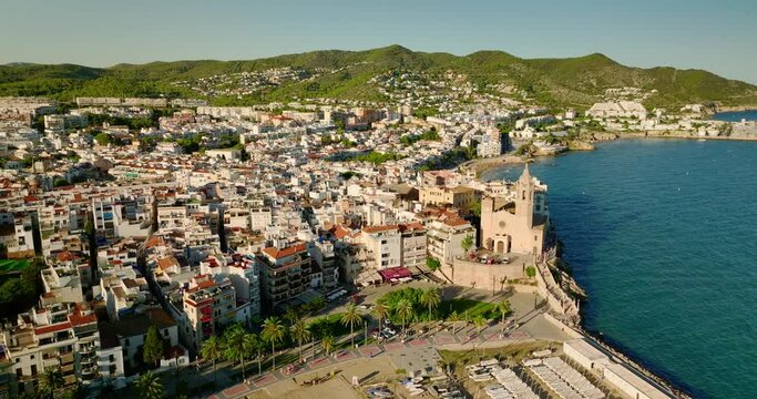 Aerial drone view of a beautiful sea and the Church of Sant Bartolomeu in Sitges