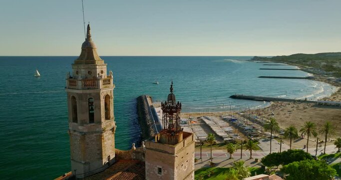 Aerial drone view of a beautiful sea and the Church of Sant Bartolomeu in Sitges