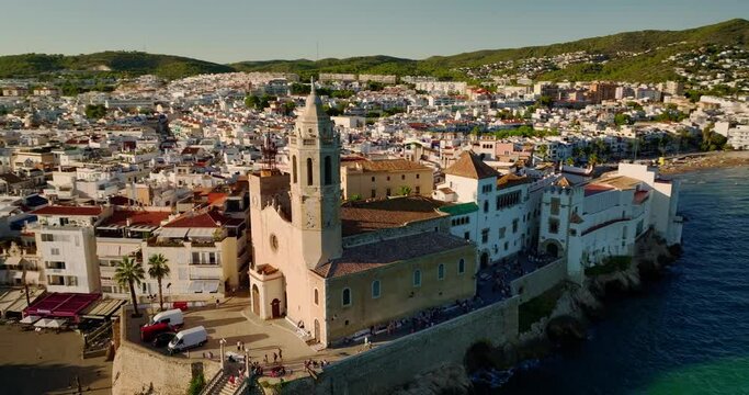 Aerial drone view of a beautiful sea and the Church of Sant Bartolomeu in Sitges