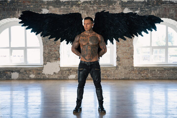  angel man with black wings, stand posing at camera. man fall from heaven, angel with muscular body...