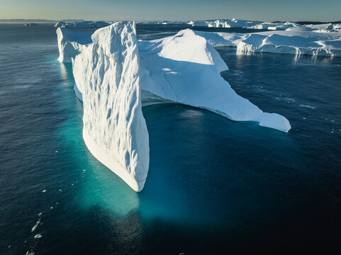 crest shaped iceberg from aerial view