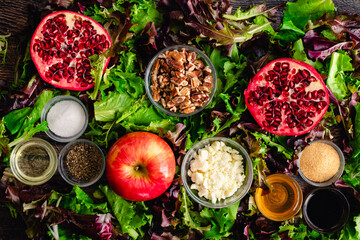 Fall Harvest Apple Pomegranate Salad Ingredients Viewed From Above: Flay lay of salad ingredients including apples, pomegranate, feta, and pecans