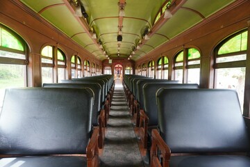Old bus interior with comfortable black seats