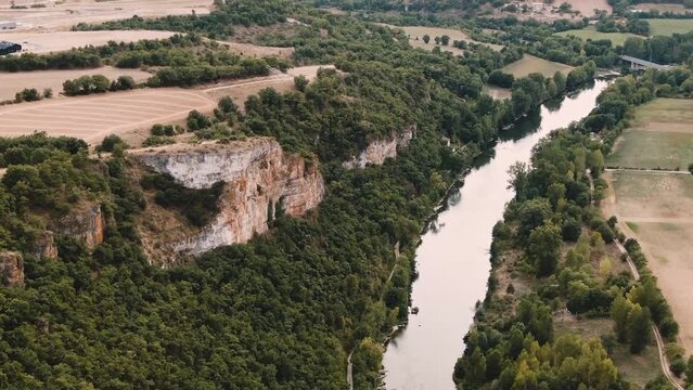 Aerial view of a beautiful landscape with a river and a forest, near Millau Village in the Occitania region of southern France.