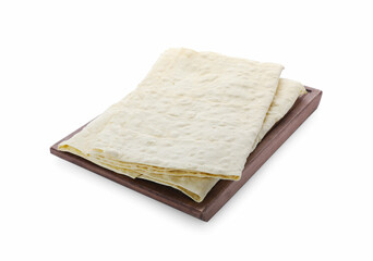Wooden tray with delicious Armenian lavash on white background