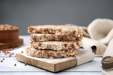 Stack of crunchy buckwheat cakes on white wooden table