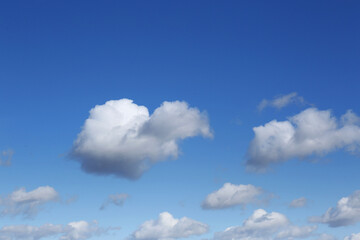 Picturesque blue sky with white clouds on sunny day