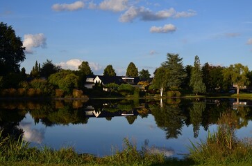 Picturesque view of pond and beautiful estate