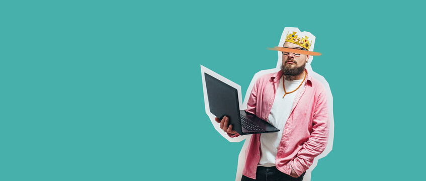 Young crazy bearded charismatic man. Shocked or surprised expression. Laptop concept. Funny promotion poster. Programmer, web developer holding a laptop in his hands and looking at the camera