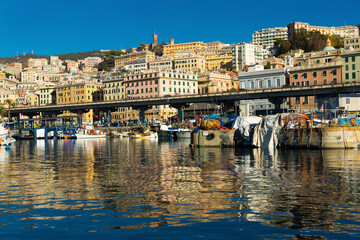 Old port of Genova and boats from sea view in Italy at sunny day