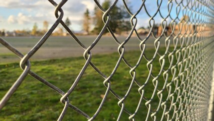 Close up of mesh fence in elementary school area in wide angle, concept of safety