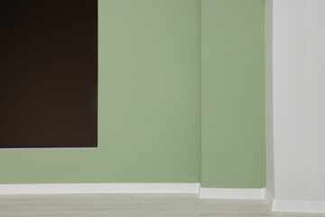 Empty office room with power outlet sockets. Opening for fake window