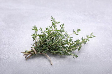 Bunch of fresh thyme on light grey table