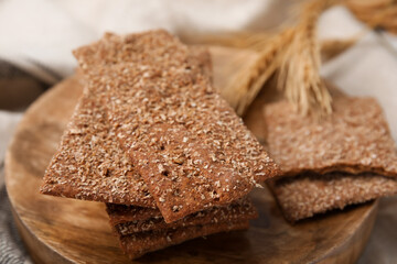 Stack of dry rye crispbreads on table, closeup