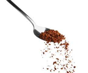 Pouring aromatic instant coffee from spoon on white background