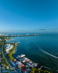 Fototapeta premium Aerial view of the beautiful coastline of Cancun, Mexico. Hotel zone. Sunset.