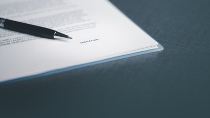 A pen and a contract on the table,Managing business documents and agreements Signing business...